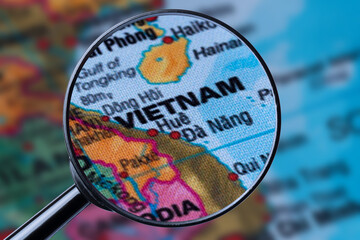 Map of VIETNAM through magnifying glass. - obrazy, fototapety, plakaty