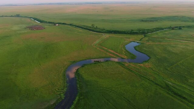 Natural river, Hortobágy canal, Hungary, aerial view. Hortobágy's Quaint River Bend
