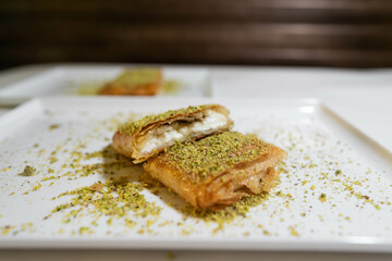 Kulaj or kullaj sweet dessert with fried dough wrapped around a creamy filling - Arabic traditional dessert - Arabic Turkish Cuisine