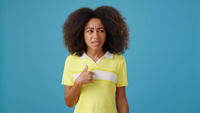 Pretty African-American denies offer with gestures on blue