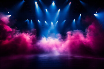 An empty stage ready for concert, with big colored lights and smoke