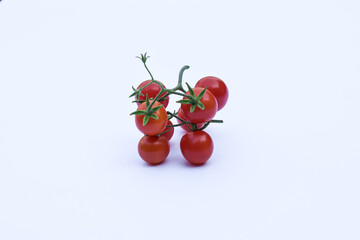 Fresh red tomatoes on a white background
