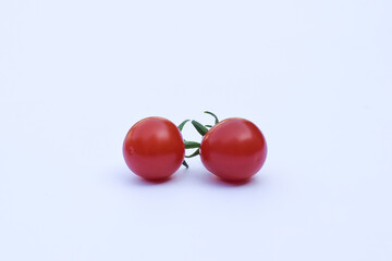 Fresh red tomatoes on a white background