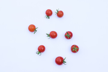 Fresh red tomatoes on a white background