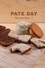 Pate Day Banner. Annual event concept shows sandwich with rye bread and pate on wooden background....