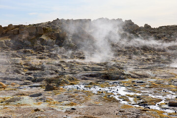 Hverir, Iceland. A surreal, bare orangy-red, geothermal area at the foot of Namafjall. Full of fumaroles, mud pools, steam vents. It's on Route 1. It is also called Namaskard Hverir.