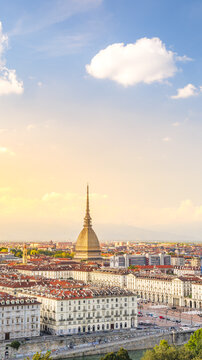 Turin, Italy. View from above on the city and the Mole Antonelliana at sunset. Vertical image. 2023-09-01.
