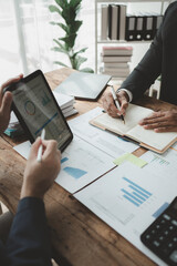 Businessmen are attending a meeting about finances, Discussing tax payments in the conference room, Meeting to plan marketing to increase operating results, Business meeting idea.