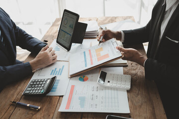 Businessmen are attending a meeting about finances, Discussing tax payments in the conference room, Meeting to plan marketing to increase operating results, Business meeting idea.