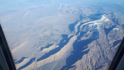 view of mountains and deserts from a passenger plane. Iran, Iraq, Persian Gulf