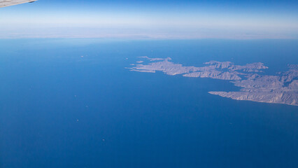 view of mountains and deserts from a passenger plane. Iran, Iraq, Persian Gulf