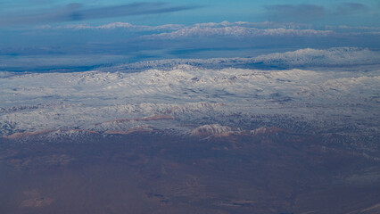 view of mountains and deserts from a passenger plane. Iran, Iraq, Persian Gulf