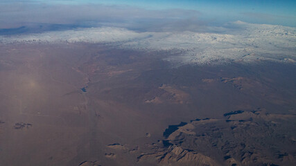 view of mountains and deserts from a passenger plane. Iran, Iraq, Persian Gulf