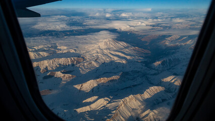 view of mountains and deserts from a passenger plane. Iran, Iraq, Persian Gulf