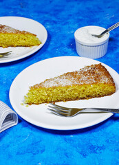 Middle eastern semolina cake basbousa , namoora, hareesa with coconut  on blue grunge background