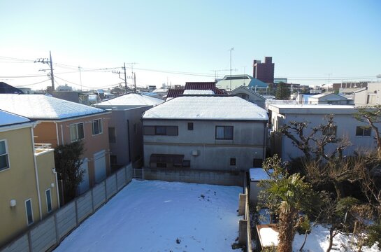 Residential area after heavy snowfall, Nihon University College of Letters and Science visible in the distance, Setagaya, Tokyo, Japan