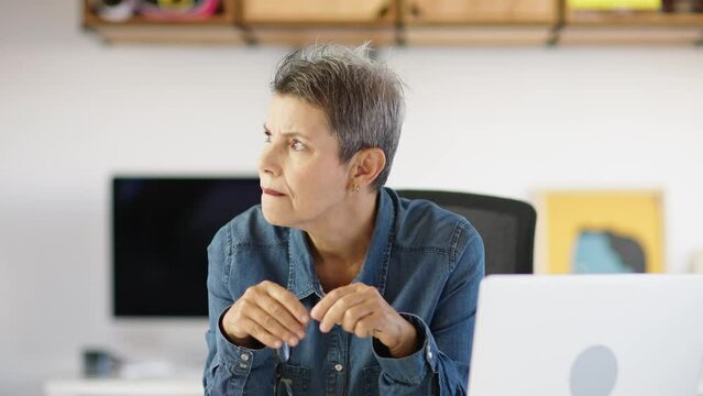 Thoughtful serious doubtful lgtb senior middle aged old woman looking away thinking of future vision, problem or question, business challenges.