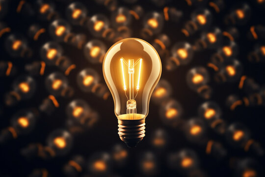 Glowing light bulb between the other light bulbs, flat lay, symbolizing big ideas, innovation concept