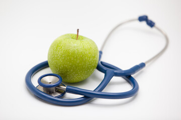 Apple on white background,stethoscope and apple.