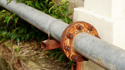 Rust corrosion flange and bolt on the old steel water pipeline distribution.Grunge rusted metal...