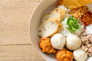 spicy small flat rice noodles with fish balls and shrimp balls without soup