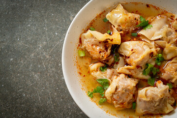 pork wonton soup or pork dumplings soup with roasted chili