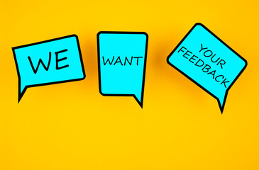 We want your feedback written white chat bubble on yellow backgrounds.