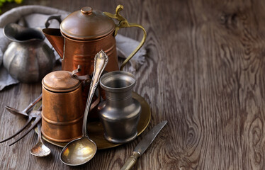 copper vintage dishes on a wooden table