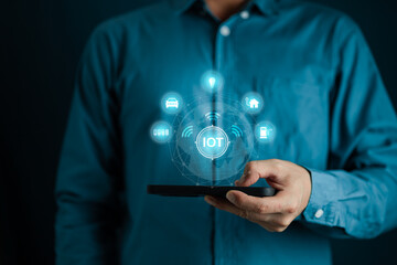 IOT Concept. Smart home technology interface on smartphone app screen with augmented reality (AR) view of internet of things (IOT) connected objects in the apartment interior, person holding device