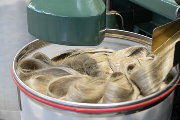 Industrial loom on textile .Flax processing plant, fabric production. Flax is made .A workshop at a...