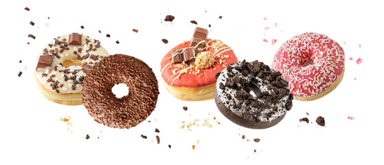 Assorted set colorful glazed donuts with mixed sprinkles and crumbs flying isolated on white background. Sweet pastry card. Fresh baked white, brown, pink, red doughnuts
