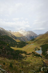 landscape with lake and mountains, vertical orientation, graubunden, grisons, switzerland