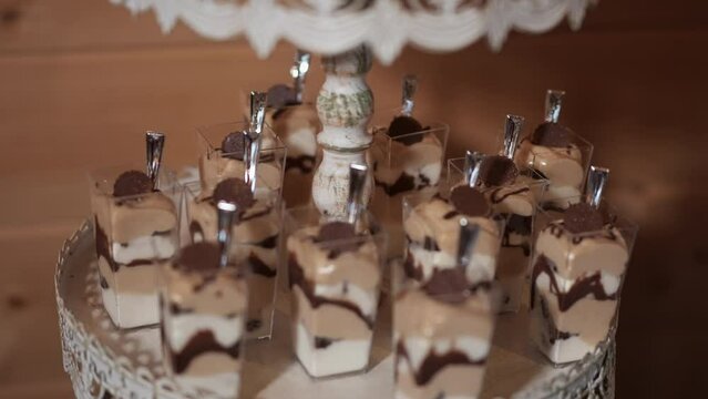 A close-up of a slice of tiramisu The tiramisu is made with chocolate-dipped ladyfingers, coffee-soaked mascarpone cream, and cocoa powder