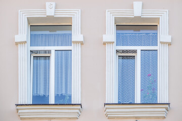 windows with decorative elements on an old wooden or brick building