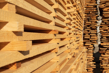 Wooden boards in a sawmill close up. Edged board. Lumber