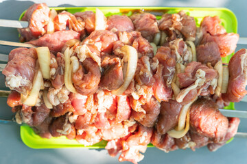 Raw meat with vegetables on a skewer, ready to grill
