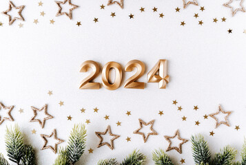 Greeting card - happy new year with numbers 2024 and gold glitter and stars on white background