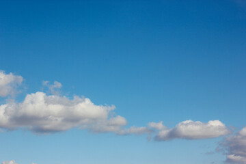 Gazing at the blue sky with white clouds can evoke a sense of calm