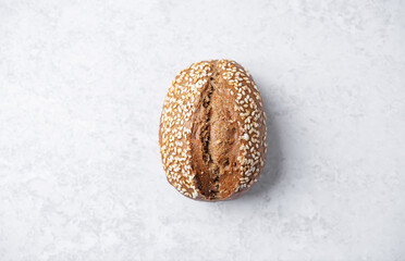 Sesame seeds rye buns on a background