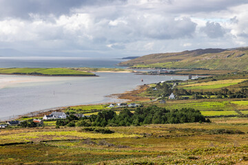 Fototapeta na wymiar Houses, Vegetation, mountains and ocean in Achill Island