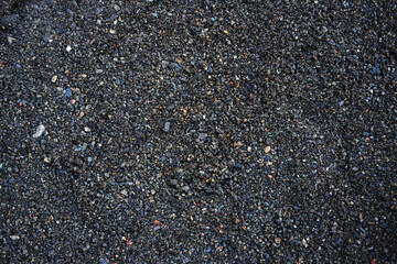 texture image of small stones. dark texture. stones. crushed stone