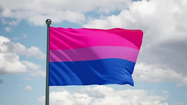 Bisexual pride flag. Pride lgbtqi+ flag flutters on the wind . Cloudy sky background