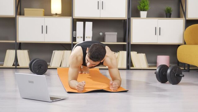 Fitness trainer teaching plank exercise.