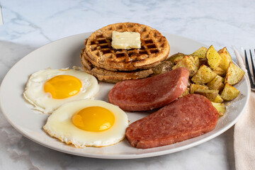 fried eggs with spam  served with waffles and home fries