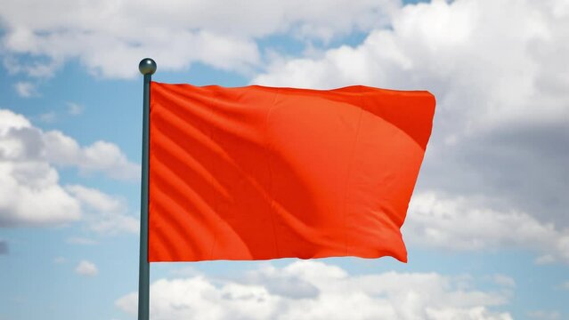 Red flag flutters in the wind. Danger caution attention symbol. Cloudy sky background. Realistic 3d render.