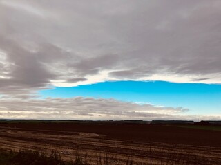 Fototapeta premium clouds over the field