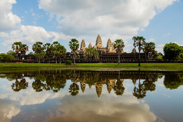 General view of the famous temple of Angkor Wat, Cambodia, Asia, photographed in the afternoon, and reflected in the water of the outer lagoons surrounding it.