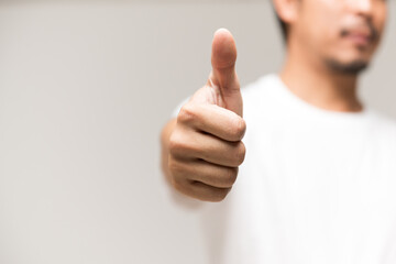 Man's thumbs up isolated on white background.Like sign finger and hand.Good idea concept.
