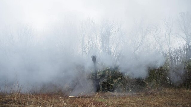 Close-up of firing from an M 777 howitzer. The concept of military operations and military weapons.