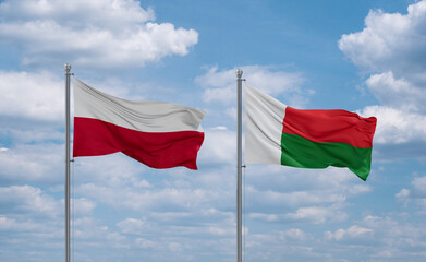 Madagascar and Poland flags, country relationship concept